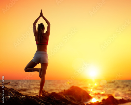 Yoga At Sunset - Girl In Vrikshasana Pose
