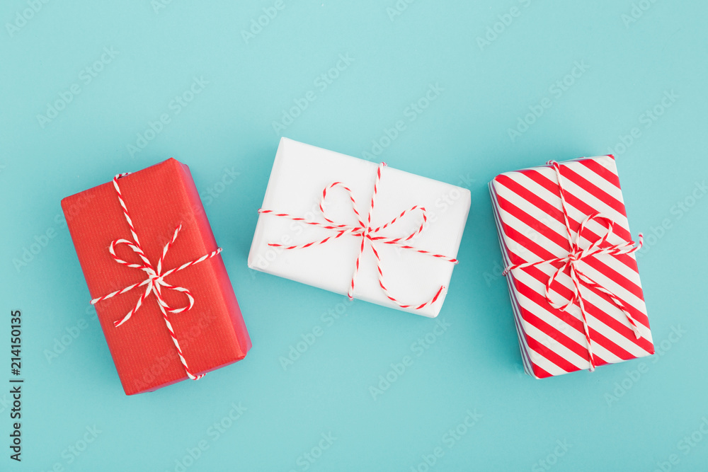 Holiday gifts wrapped in three different papers. Holiday gifts wrapped in three different papers.