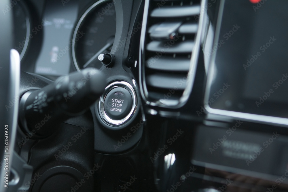 Car engine start stop button of a modern car.