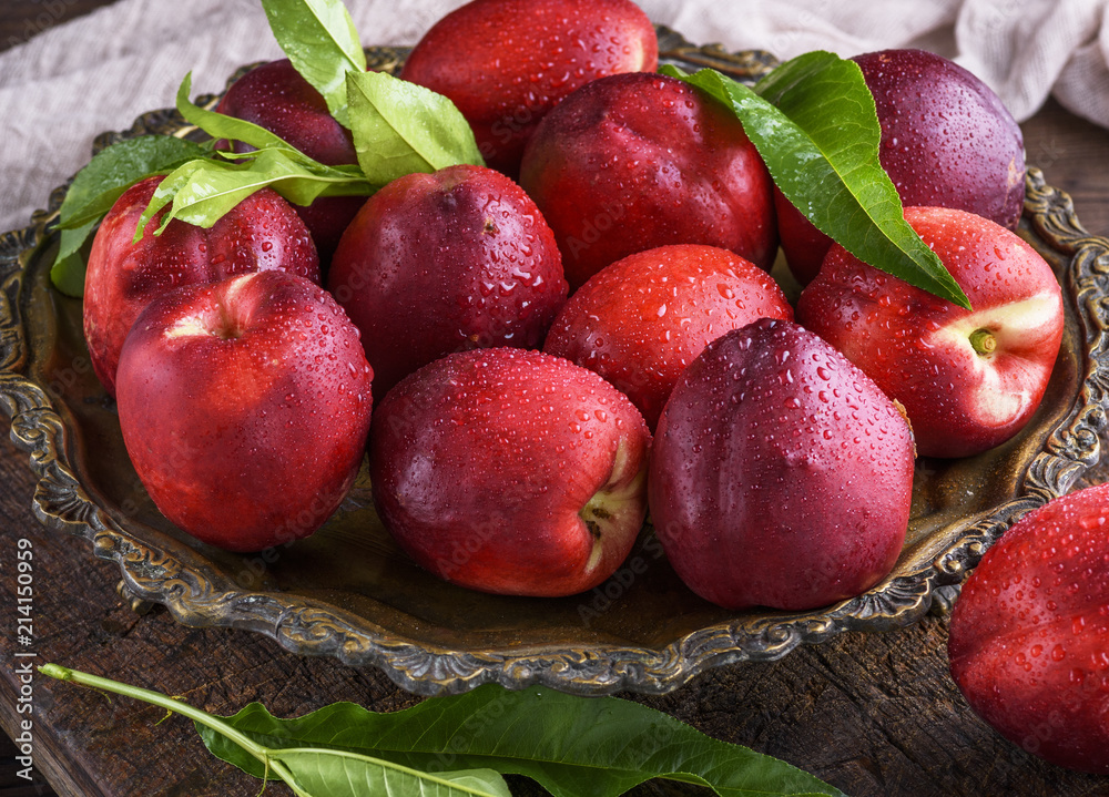 red ripe peaches nectarine in an iron plate red ripe peaches nectarine in an iron plate