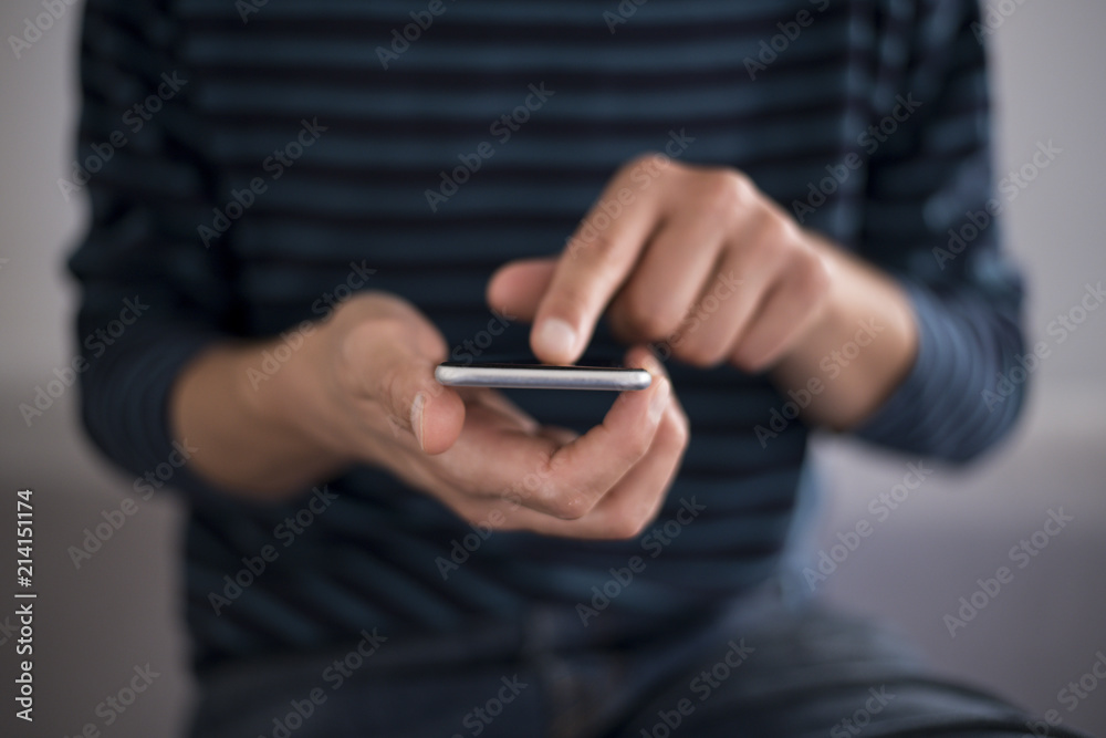 Young man using a touchscreen smartphone - Hands close-up - Using technology Young man using a touchscreen smartphone - Hands close-up - Using technology