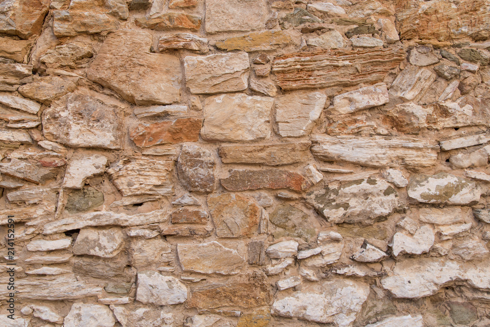 Fototapeta premium pattern gray color of modern style design decorative uneven cracked real stone wall surface with cement