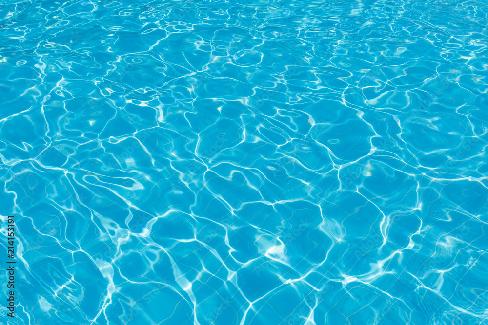 Clean turquoise water in the swimming pool as a background or backdrop