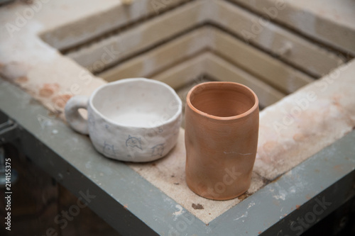 Raw pottery piece on a kiln © craftykat