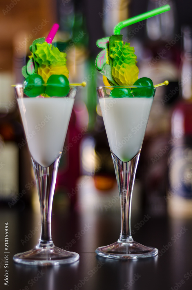 exotic drink based on Malibu rum and other ingredients, cocktail prepared by the bartender exotic drink based on Malibu rum and other ingredients, cocktail prepared by the bartender