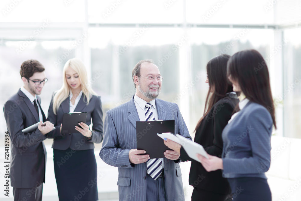 close up.group of business people standing in lobby of office. close up.group of business people standing in lobby of office.