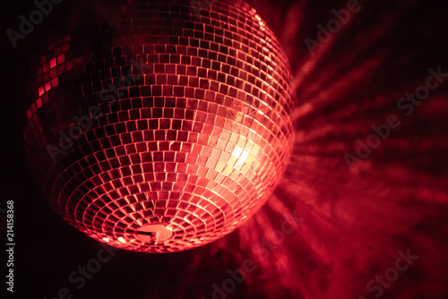 lone disco ball illuminated red