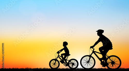 silhouette Sport man whit bike on sunrise © rathchapon