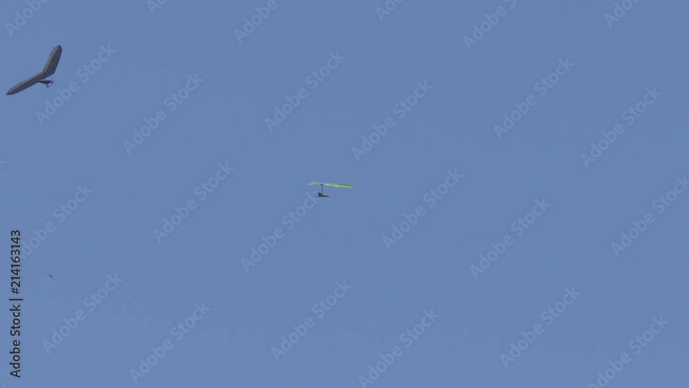 Colorful paragliders in the sky