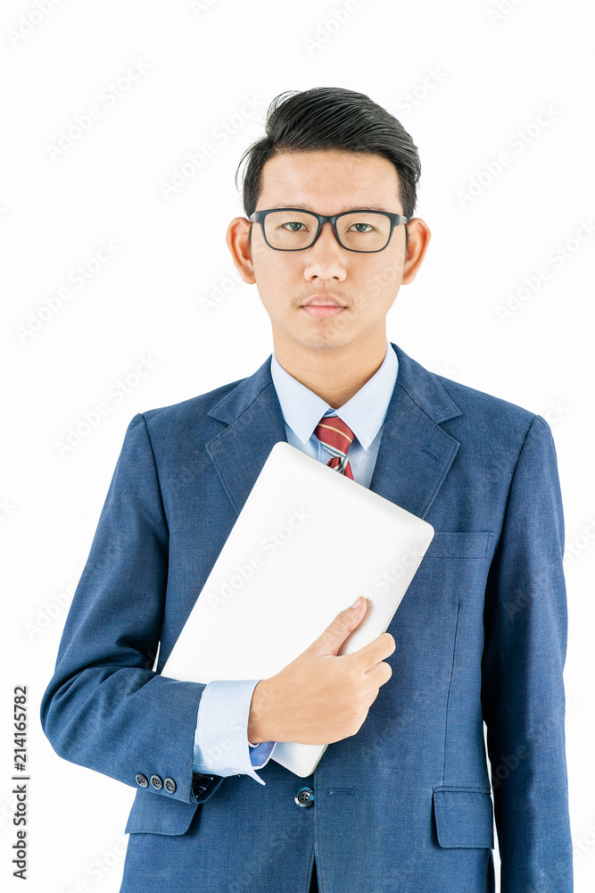 Businessman portrait in suit holding a laptop over white background Businessman portrait in suit holding a laptop over white background