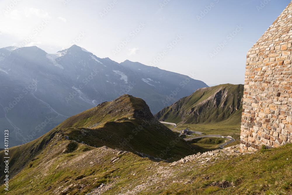 Naklejka premium Alpine scenery on the top of the Grossglockner mountain pass, with the road in the background, in the Austrian alps in Europe in summer