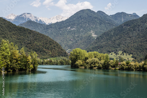 Fototapeta Naklejka Na Ścianę i Meble -  Stunning view of the Isonzo river at the feet of the Triglav mountain in Slovenia in Eastern Europe on a sunny summer day