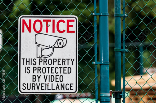 Картината върху платно Notice private property video surveillance sign on chain link fence
