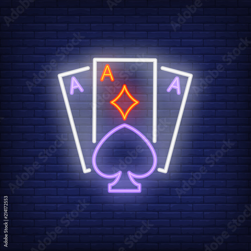 Playing ace cards neon sign. Diamond, spade, brick wall. Night bright advertisement. Vector illustration in neon style for gambling, casino and poker club