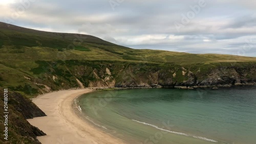 Malainn Bhig also known as Malinbeg is a secluded bay visible from the Silver Strand beach Discovery Point and dramatised by the surrounding high, horseshoeshaped cliffs. photo