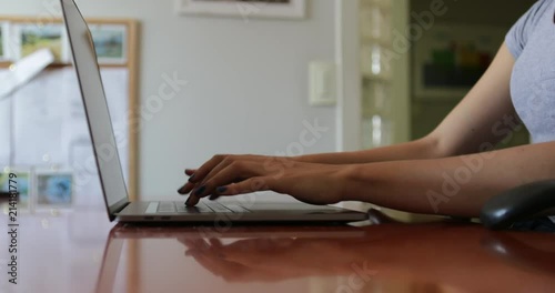 Girl typing on computer laptop keyboard2 photo