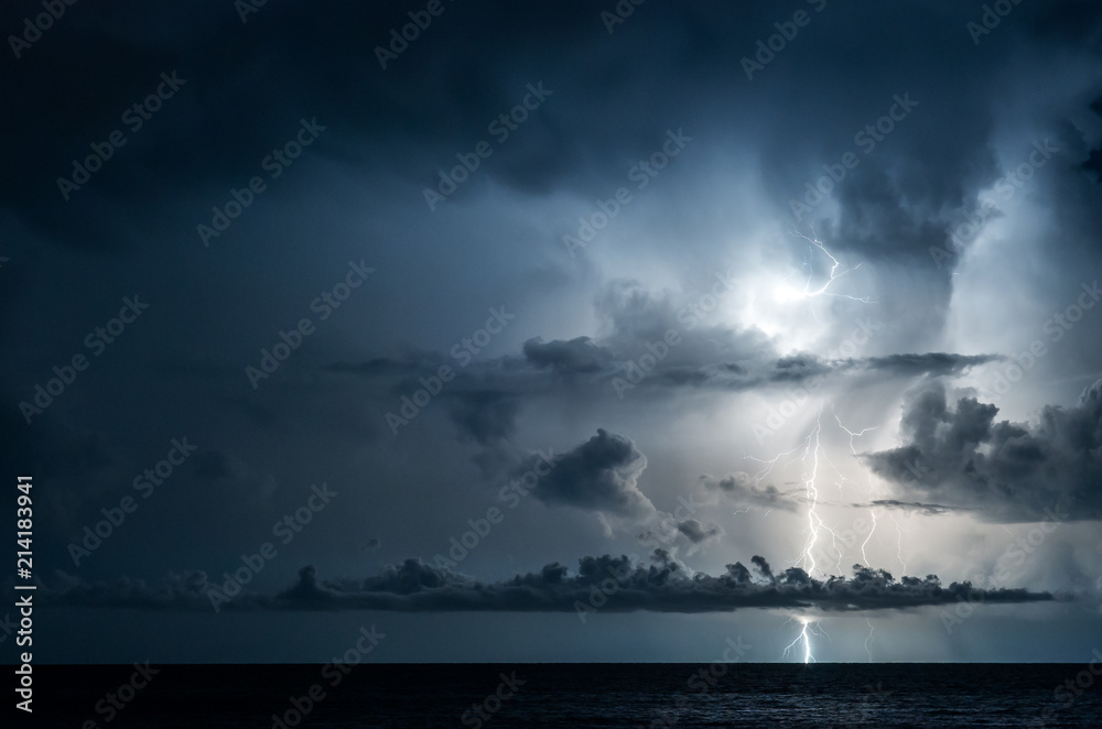 Lightning in the sea with high clouds