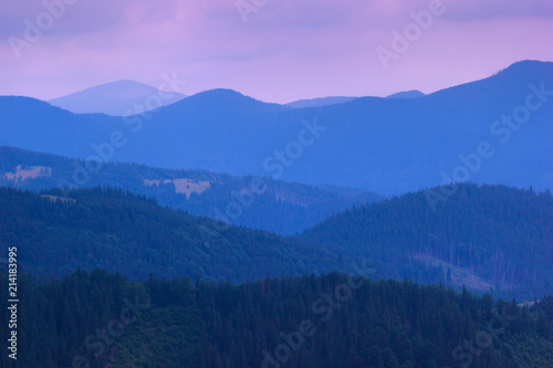 Colorful mountains silhouette landscape with pink sky at sunset 