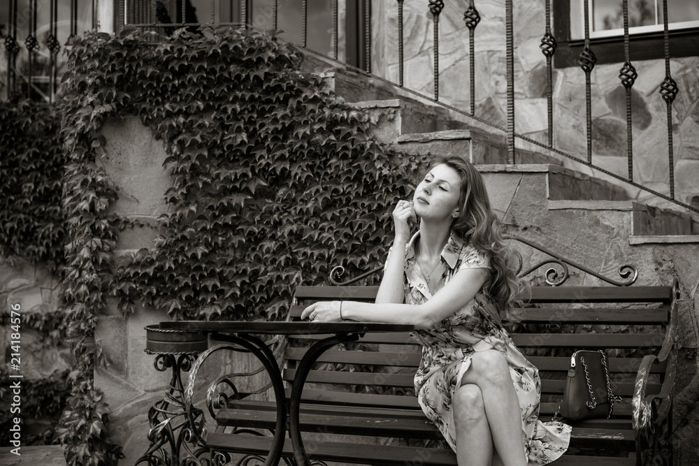 Obraz premium Nature, summer holidays, vacation and people concept - young woman dreaming about good life and enjoy the moment 