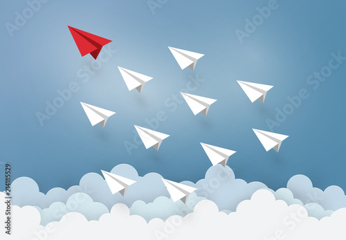Leadership and Business concept with Origami made Red paper plane flying in the sky. paper art design and craft style.