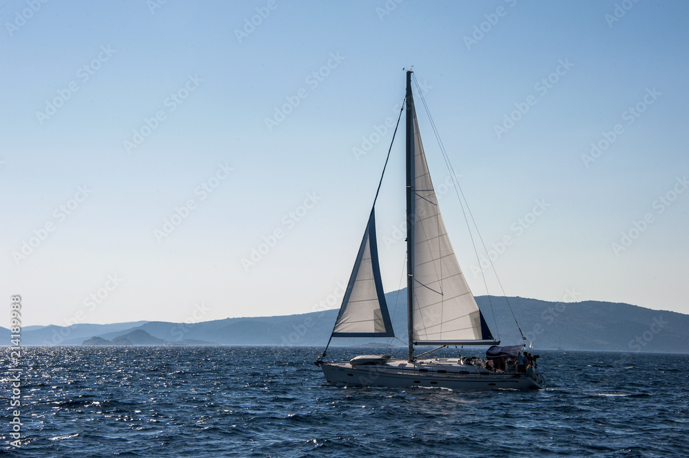 Sailboat sailing among the many beautiful islands of Croatia. Hvar, Brac, Vis, Korčula.