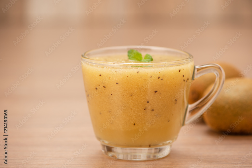 Tropical fresh fruit set and juice smoothies isolated with wooden background Tropical fresh fruit set and juice smoothies isolated with wooden background