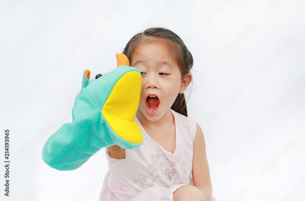Adorable little Asian child girl hand wear and playing Rhinoceros puppets on white background. Adorable little Asian child girl hand wear and playing Rhinoceros puppets on white background.