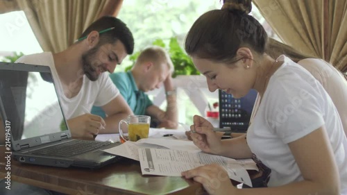 Students work in cafe, one young man fell asleep