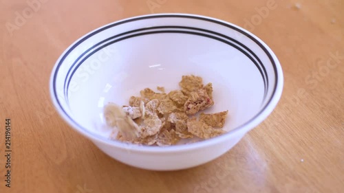 Cereal being poured into a bowl 4K photo