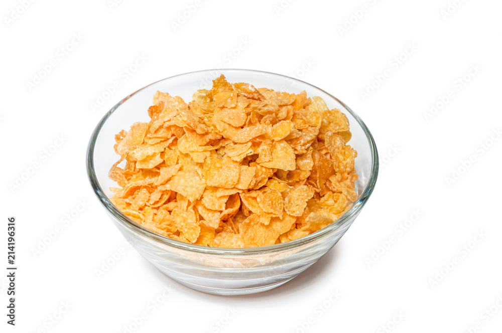 corn flakes in a glass bowl on a white background corn flakes in a glass bowl on a white background