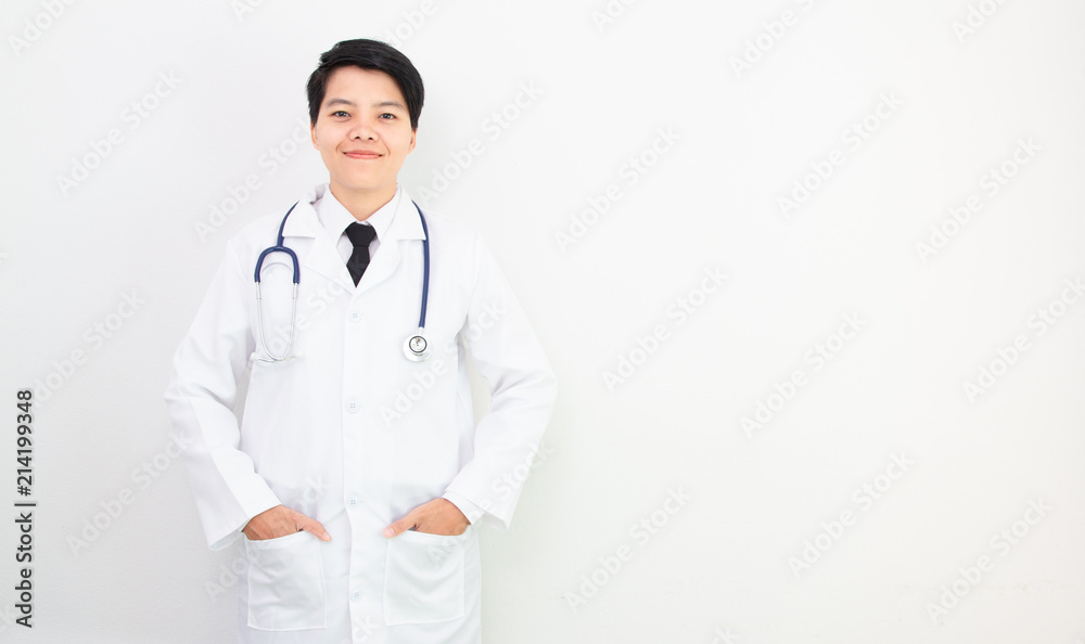 Soft focus. asian doctor smiling look to camera with stethoscope on gray background. Soft focus. asian doctor smiling look to camera with stethoscope on gray background.