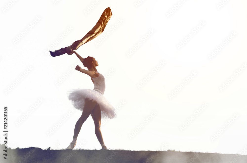 Fototapeta premium Ballerina posing in tutu outside