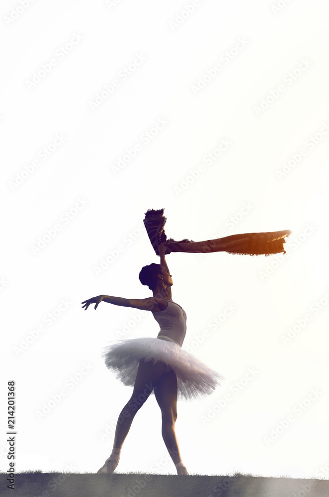 Siluette of ballerina posing outside