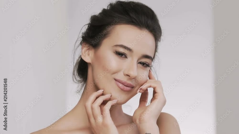 Attractive brunette model at studio background Attractive brunette model at studio background
