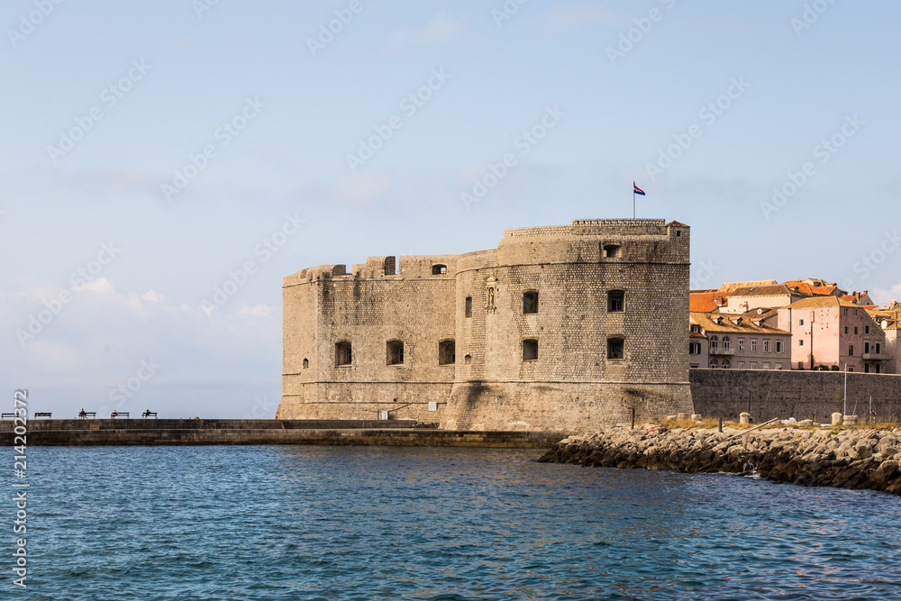 the famous fortification of Dubrovnik old town guarding the harbor on a sunny summer day in Croatia in Eastern Europe.