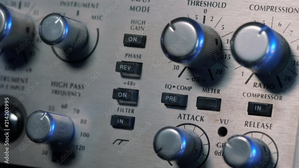 Adjustable handles on the compressor panel in professional recording studio. Natural light. Sound mixing concept. Dolly shot. 4k.