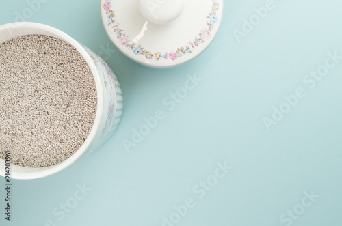 salvia hispanica seeds in a porcelain jar - colors and objects backdrops
