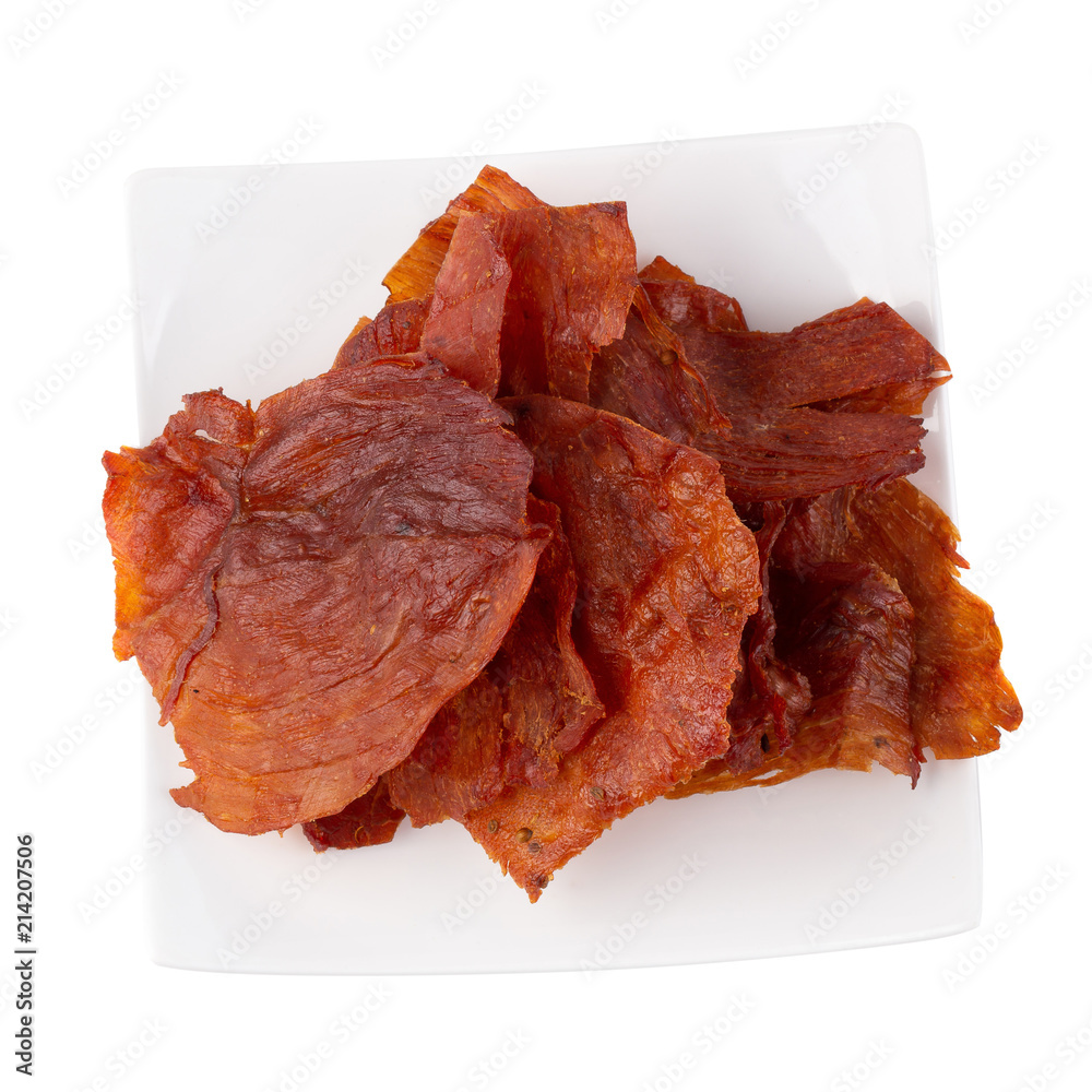 Sweet pork sheet - asian food style in white plate isolated on a white background. Sweet pork sheet - asian food style in white plate isolated on a white background.