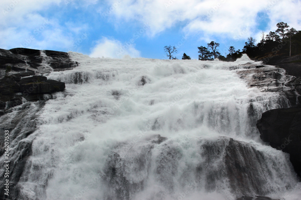 Nyastolfossen falls, the second in cascade of four waterfalls in Husedalen valley, Kinsarvik, Norway