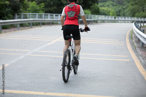 Wallpaper Mural Woman cyclist riding mountain bike on road Torontodigital.ca