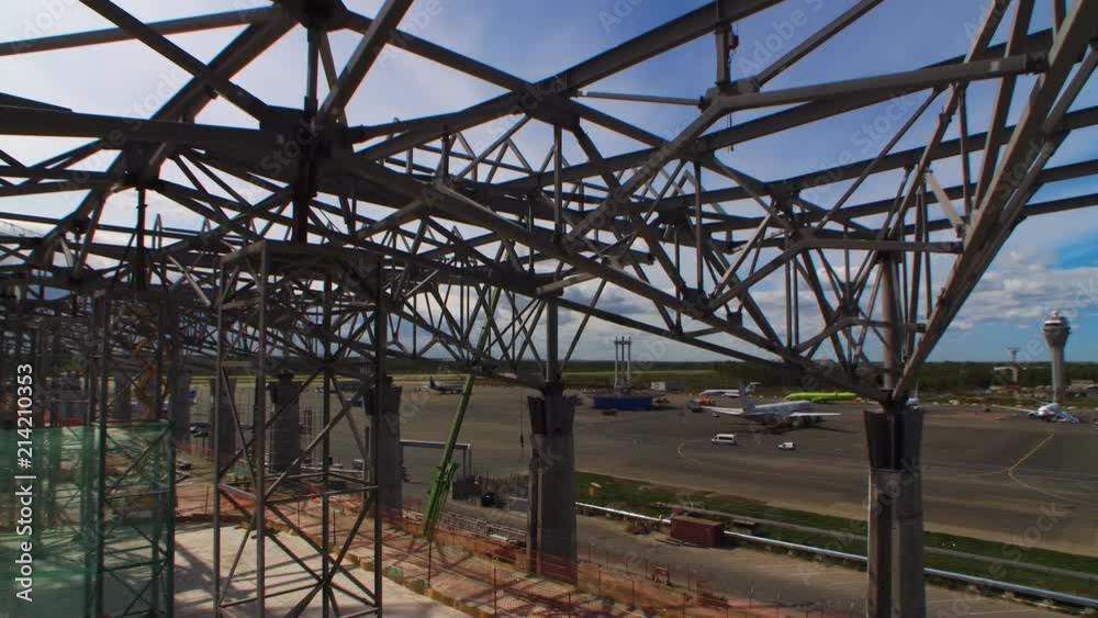 Metal beams are used as the basis in the frame of the new building of Pulkovo Airport. View on the airport from the construction site Metal beams are used as the basis in the frame of the new building of Pulkovo Airport. View on the airport from the construction site
