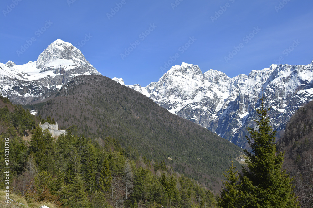 The Slovenian Alps in April, including Mangart on the left. Viewed from Lake Predil or Lago del Predil in Friuli, Italy
