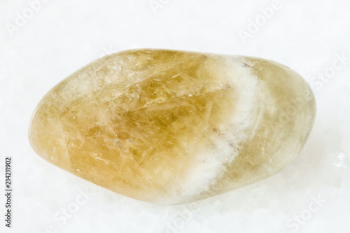 tumbled Prasiolite gemstone on white