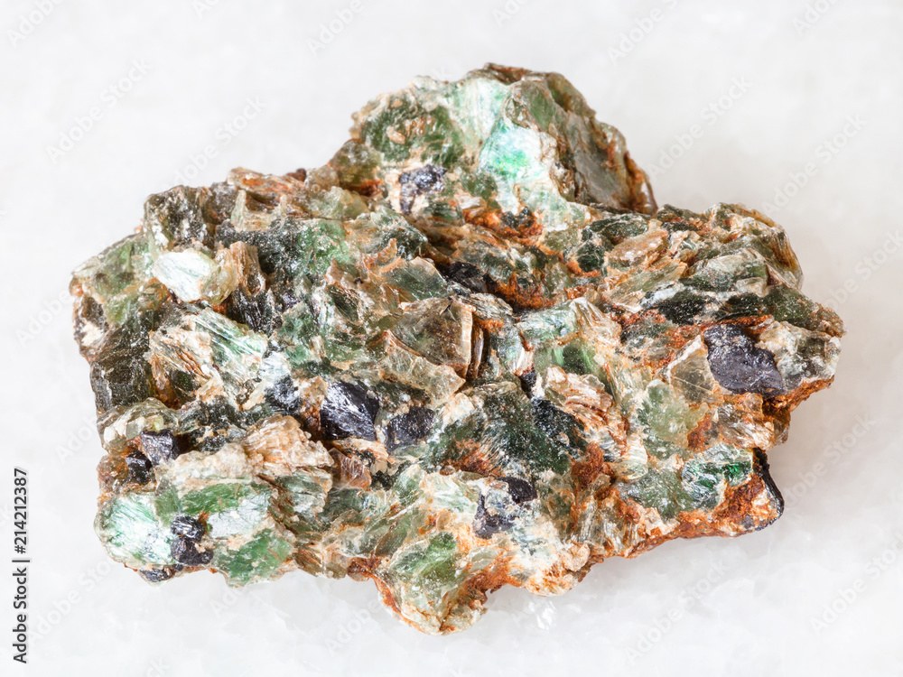green beryl crystals in rough rock on white green beryl crystals in rough rock on white