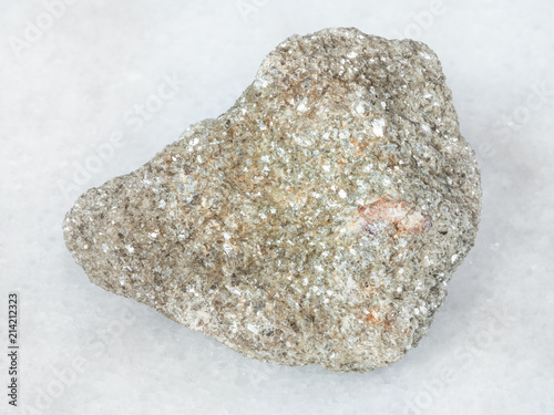 greisen rock with spessartine crystal on white photo