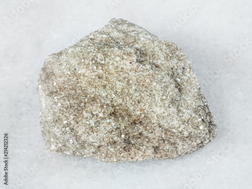 rough muscovite greisen rock on white photo