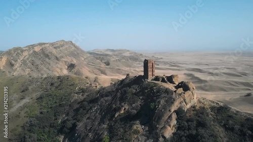 4K aerial video of ancient fortification is on the border of Georgia and Azerbaijan. Beautiful view of a sandy valley. Part of David Gareji monastery complex