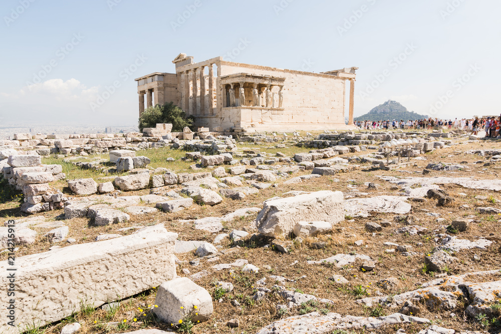 Tourists visiting the ruins of Athena Polias temple