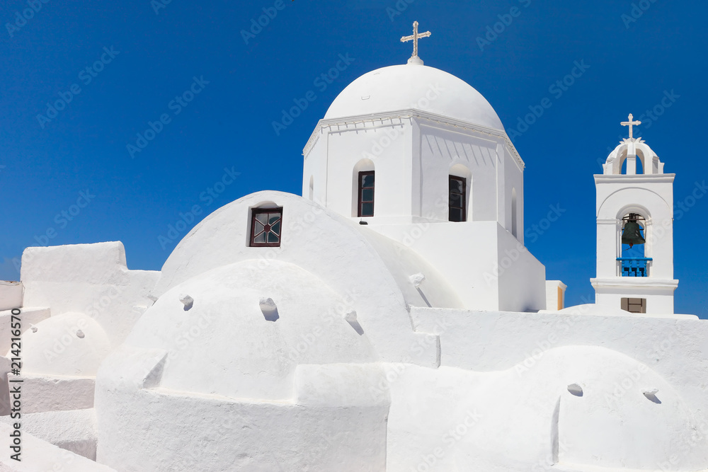 Greece, typical white church on the blue sky of Megalochori, Santorini