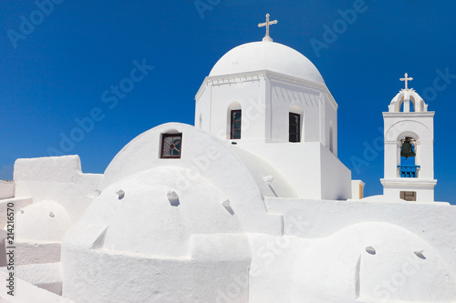 Greece, typical white church on the blue sky of Megalochori, Santorini